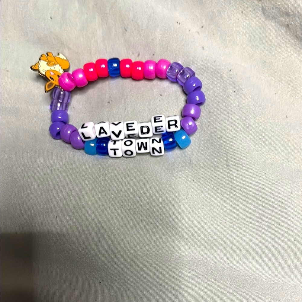 Lavender town Kandi handmade with eve charm